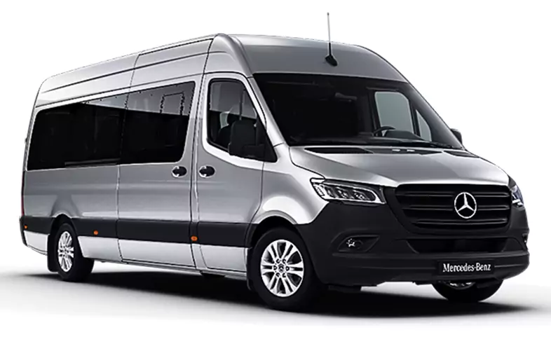 A silver Mercedes-Benz luxury minibus with 13 seats, designed for group transfers and executive travel.